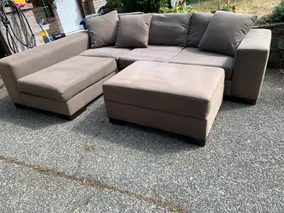 Tan sectional sofa with storage ottoman in good condition, some wear n tear to be expected. Been dee...