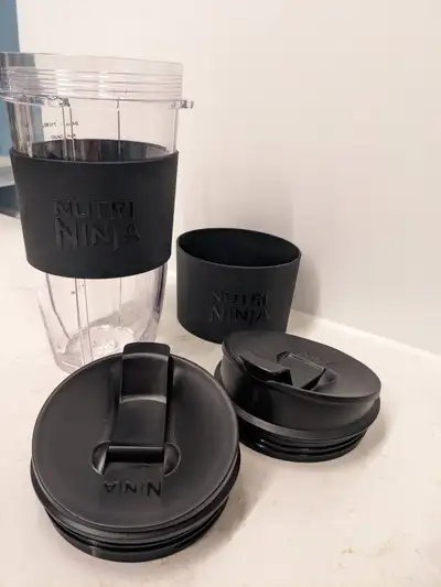 Never used. 2 lids and 2 rubber sleeves $10 for all four pieces, must take all - Check my other list...