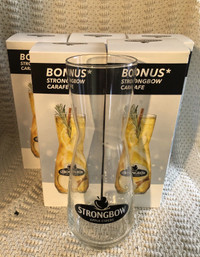 Seven  10” High Strongbow Carafes. 
