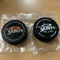 The Saints MJHL hockey pucks Cooper Pair 