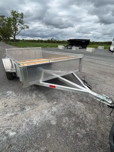 6x10 Aluminum trailer for rent. 3500LB drop axle with Bi-fold ramp giving it less wind drag. Payload...
