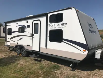 Combine a quad bunk room, a king bed, a large U shape dining area and an ultra light 4,700 pounds an...