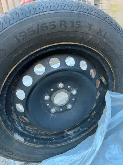 Selling a set of 4 Continental winter tires mounted on black steel rims. The set was used on a 2015...