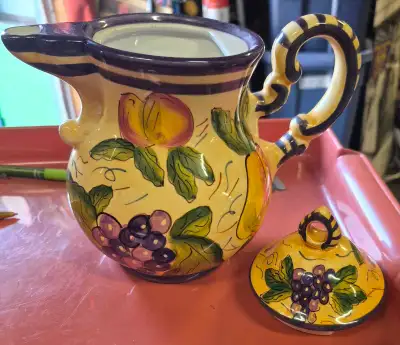 Add a touch of warmth to your kitchen with this charming, pre-owned ceramic teapot featuring a vibra...