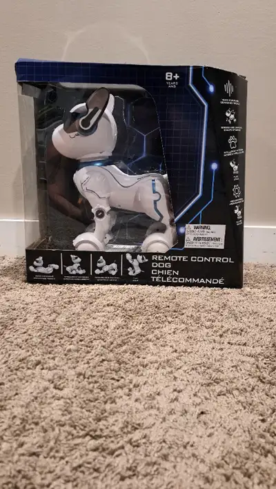 LIKE NEW. Remote control dog.Barely used. Batteries and charger included.Still in the box with manua...