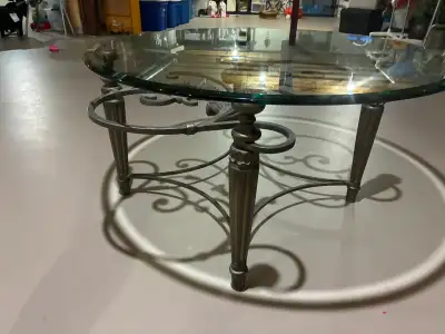 Elegant Round Glass Coffee Table with Ornate Metal Base – $200, View more