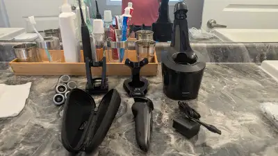 Leftover parts from my S9000 series shaver. Cleaning station without solution. $20 Travel case. $5 C...