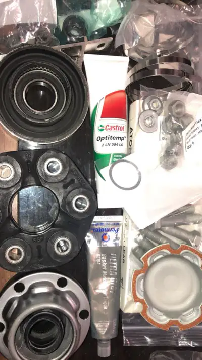 BMW E46 330CI DRIVESHAFT CV JOINT OEM FLEX DISC GUIBO OEM COMES WITH ALL NUTS AND BOLTS ON THE LIST...