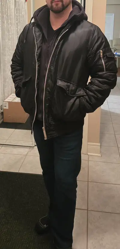 Very comfortable warm winter jacket with great insulation and a puffer-like feel. Has various pocket...
