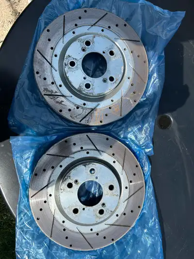 Pair of drilled and slotted rotors from front of 2007 Acura MDX. Also fit 07-13 MDX, 09-15 Honda Pil...