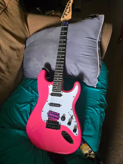 Pink electric guitar, View more