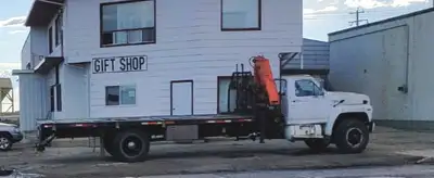 5 ton Picker truck with outriggers. 429 4 valve in running order on propane. 5 speed manual transmis...