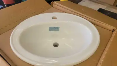 New sink in box with instructions and template