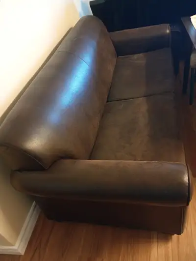 Brown Faux Leather Sofa with Sofa bed inside. Used 10 years., View more