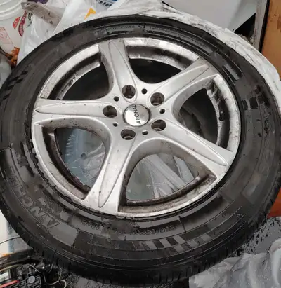 Used tire and wheel. Size: 225/55R18. Tubeless steel belted radial. DOT EJ N7. Includes wheel.