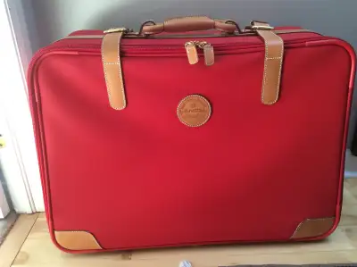French made luxury luggage. Red colour . Combines functionality and elegance. 2 wheels and waterproo...