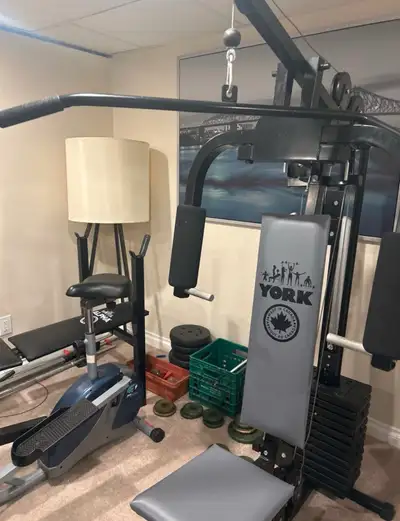 York full gym, comes with yoga ball, chest presses, Lat pull down, Leg curls, Leg extension, dumbbel...
