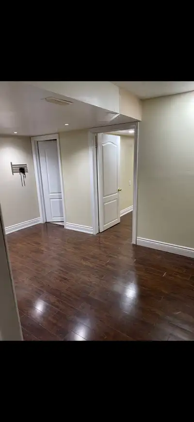 Sharing basement 2 rooms, one room is being rented by 2 people and the room available with one women...