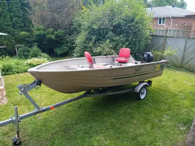 Very solid deep wide body 14 ft aluminum fishing boat in great overall condition with a good solid t...