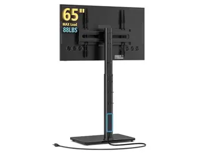 I'm offering a used universal floor TV stand with a mount and integrated power strip, designed to ho...