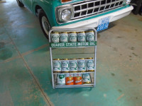 Quaker State oil rack and cans