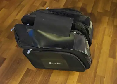 Throw over saddle bags for motorbike. Lots of compartments and storage.