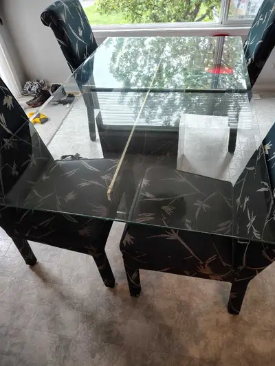 This elegant John Scott dining set features a glass top table with a striking marble base and four c...