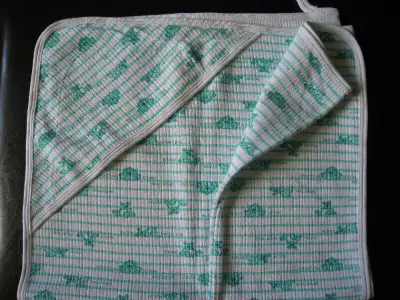 Soft jersey cotton blanket. It was washed once, but never used. Very well made.