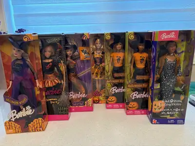 These are all that remain from my collection of Halloween Barbie dolls. They are all NRFB. 2005 Barb...