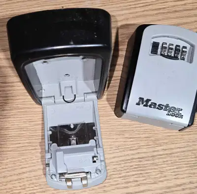 These model H-9880 lockboxes appear unused. They are unlocked read for a new combination to be enter...