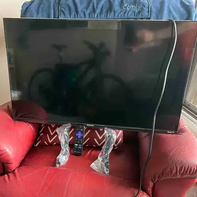 Philips 32-inch Roku TV w remote and leg stands. Paid 225w tax, View more