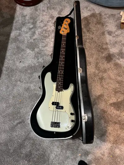 Fender Precision Bass, Made in USA in 1997. Inca Silver. Light scuffs. Hasn’t been tuned or had new...