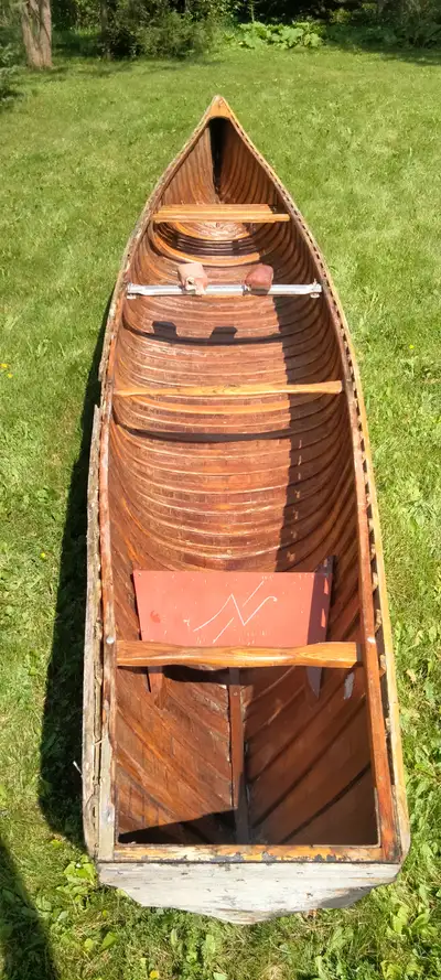 Rib and plank, with outer hull fiber glassed with West System Epoxy. Motor or paddle your choice. 40...