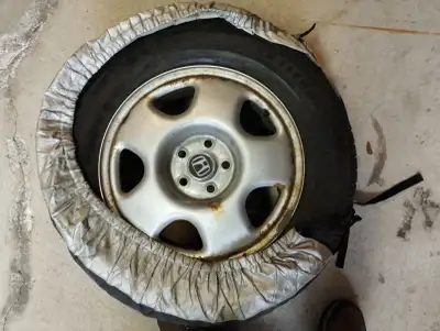 I am selling a used Michelin Latitude tire, size 225/65R17, mounted on a Honda rim. This tire shows...