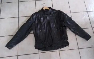 LARGE Heavy duty leather motorcycle jacket. This will not only keep you safe, but keep you warm 4 po...