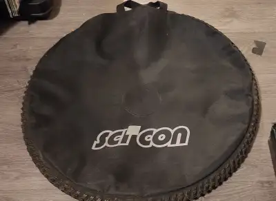 A classic Sci Con large treaded wheel bag. Unique treaded tire surround New just a bit dusty from be...