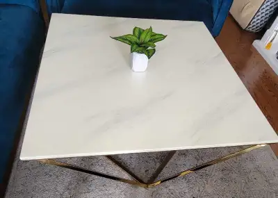 Selling Coffee Table with gold finish and marble on it. It's in very excellent condition. Price : $2...