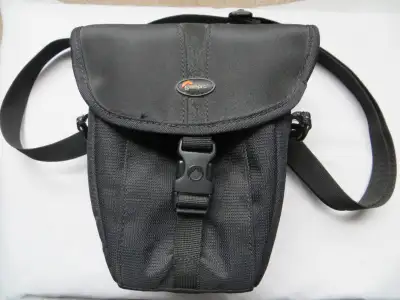 Camera Bag with Shoulder Strap Lowepro Camera Bag. With shoulder strap, snap-on cover, front pockets...