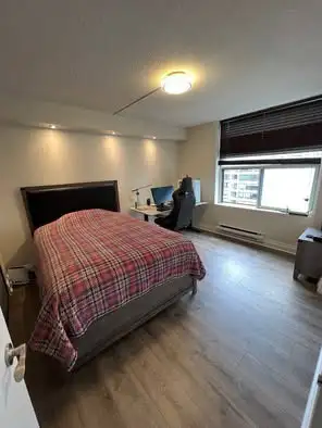 Bright and spacious 2+1 (almost 3 bedrooms). Technically den is a 3rd bedroom with twin size bed spa...