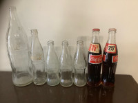 Vintage Coca Cola bottles.. 7 total