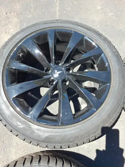 Need to sell a set of Pirelli Sottozero 255 45 19 winter tires and rims that were used on Tesla mode...