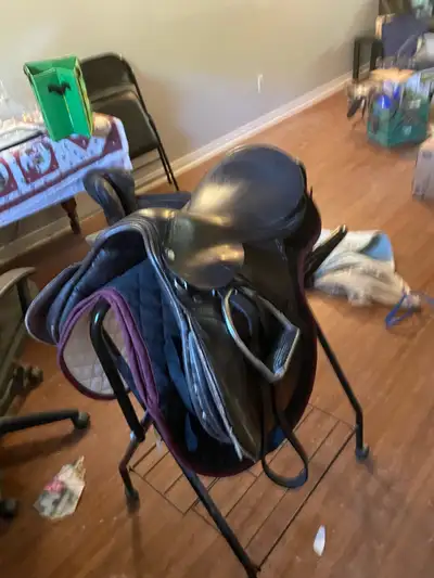 15 inch saddle included stirrups, saddle pad and bridle with eggbut bit 100 firm cash please. Cornwa...