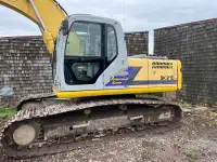 Kobelco 210 with digging bucket and 5500 lb hammer