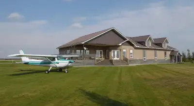 West Air Estates, a home for you and your airplane! The hangar is huge, measuring 14' high by 58' x...