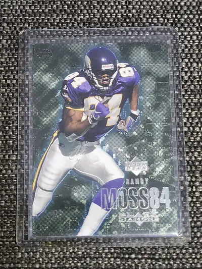 Selling collectible Randy Moss football card in good condition comes with Toploader sleeve please se...