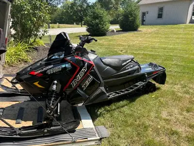 129" track, studded mirrors, electric visor hook up, reverse, rear seat bag/dash bag. Mid/short wind...