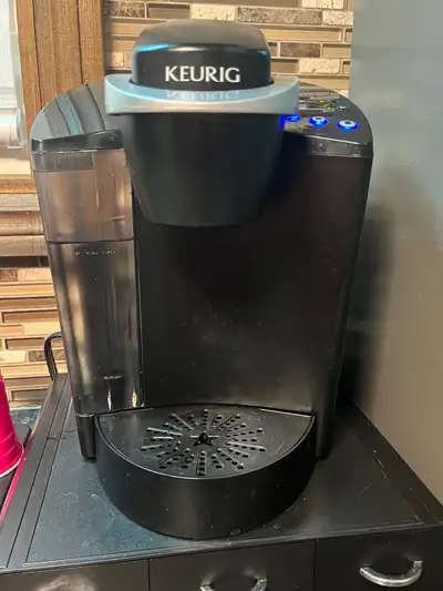 Keurig coffee maker K cup and filter and pod stand $60, View more