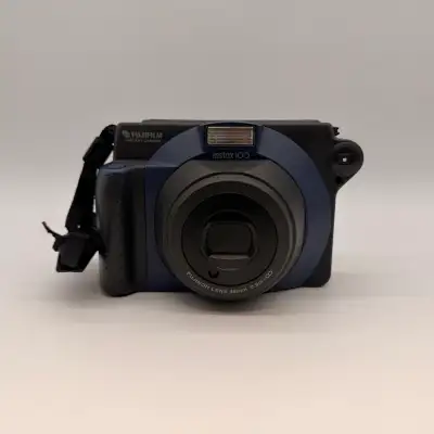 Fujifilm Instax 100 instant camera in good working condition. Tested and works properly. Uses Fujifi...