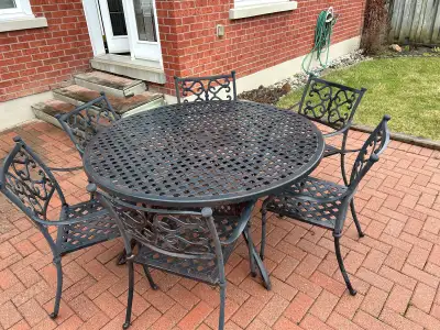 Outdoor 60” cast iron patio table with 6 chairs , View more