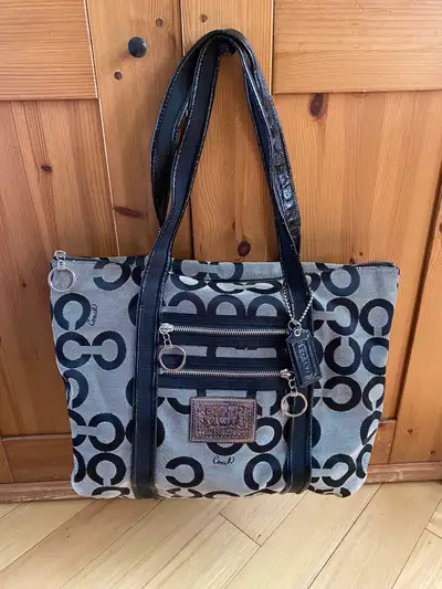 Gently used Coach Tote. Purple interior. Some wear. Up for offers. Check out my other listings